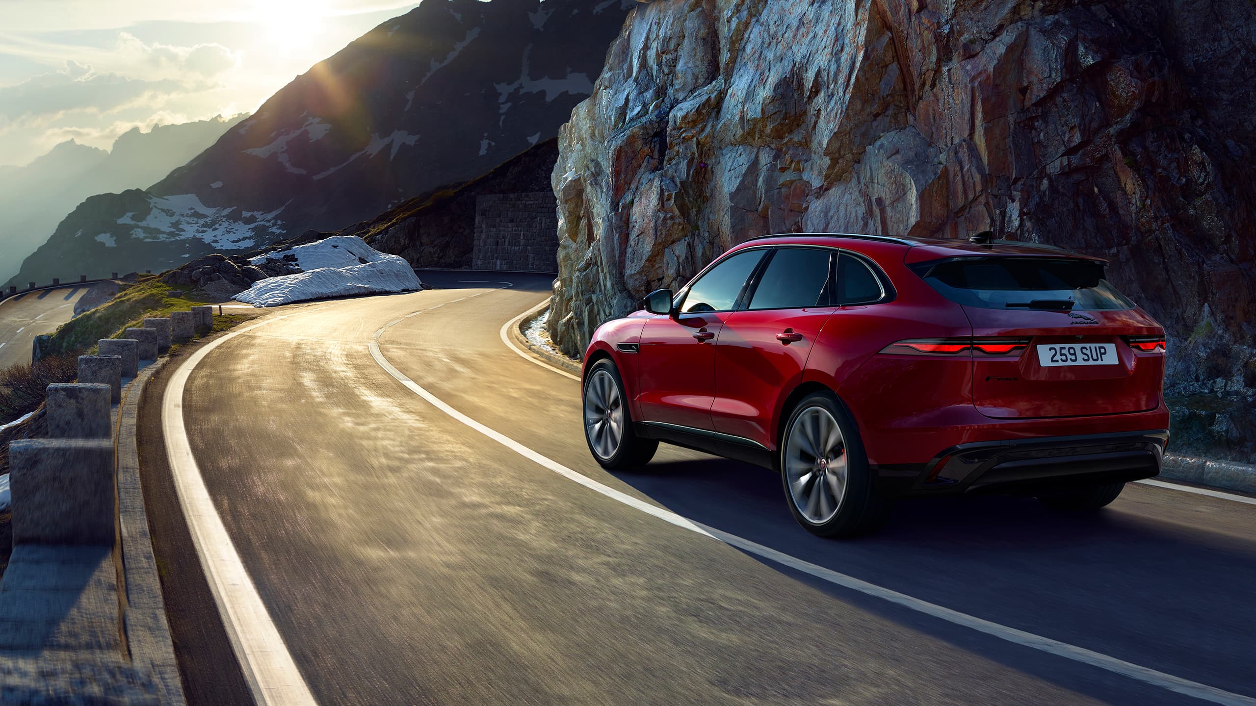 Jaguar F-PACE running on mountain hill road